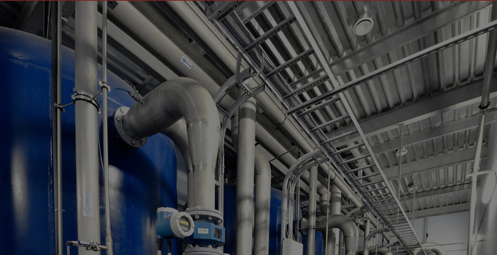 Industrial process piping and plumbing systems installed inside a manufacturing facility